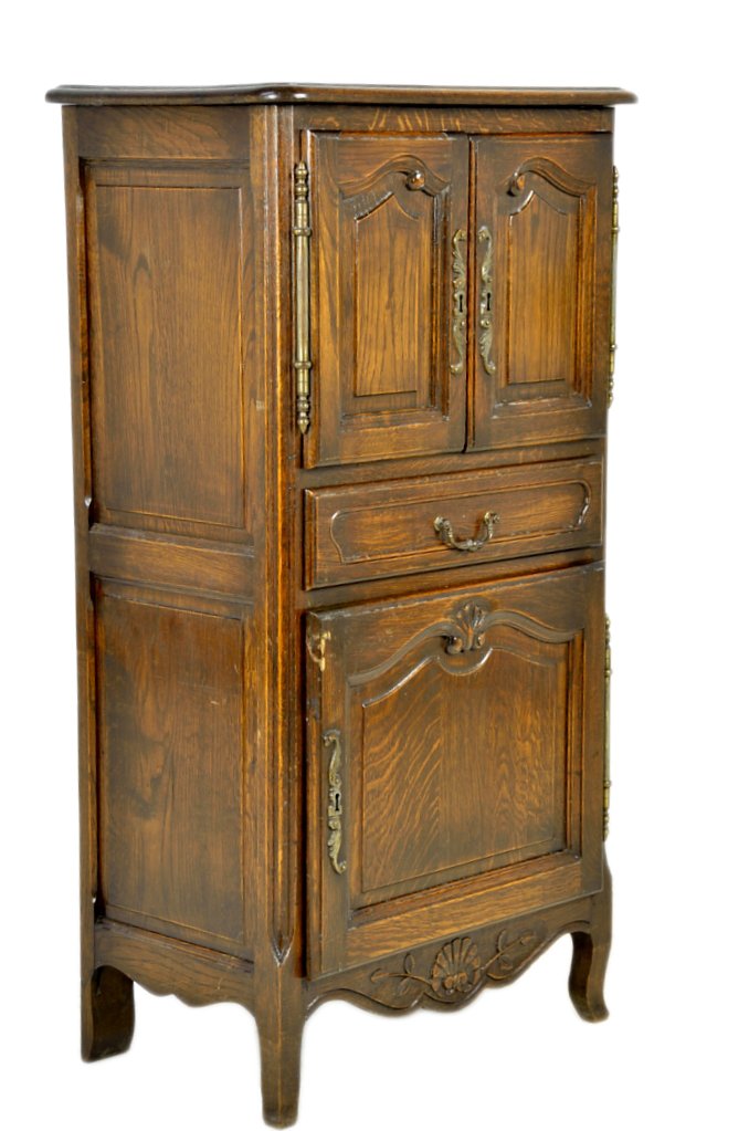 LOUIS XV PROVENCAL STYLE CABINET: LOUIS XV PROVENCAL STYLE CABINET 20th Century A petite upright oak cabinet, panel construction with carved accents, pierce cut bronze escutcheons with bronze bale pull and hinges. 47½ x 25½ x 15¾ i