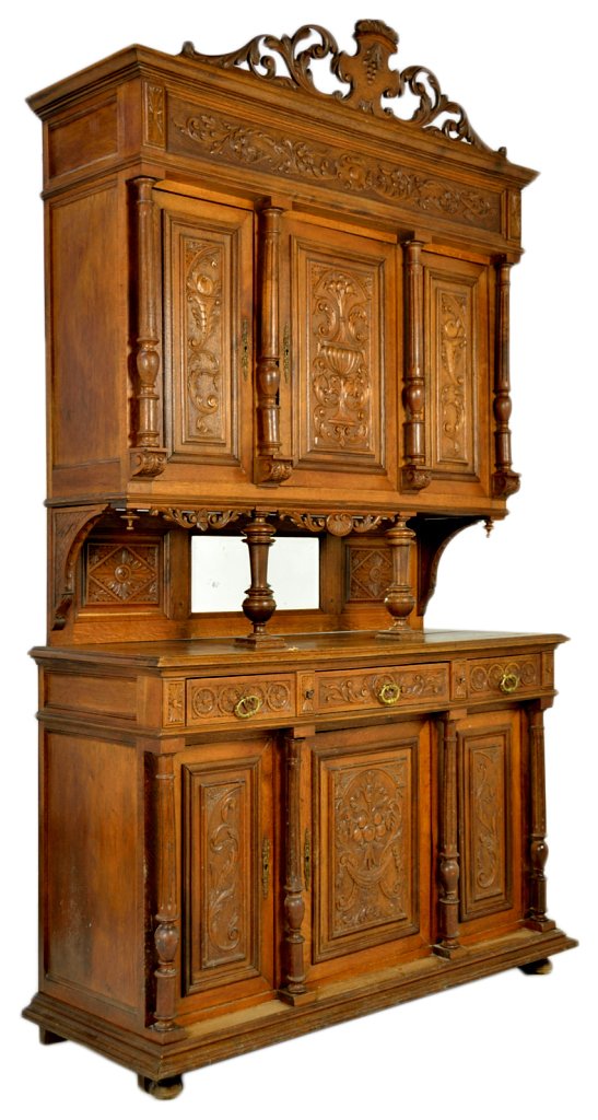 ANTIQUE FRENCH VICTORIAN CREDENZA: ANTIQUE FRENCH VICTORIAN CREDENZA 19th Century Solild Oak; heavily carved door and drawer panels with turned and fluted columns seperating each. Floral and foliate carved frieze panel with a pierce ca