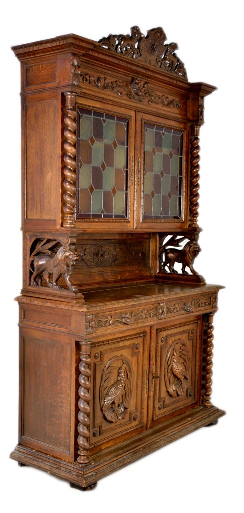 ANTIQUE FRENCH VICTORIAN CREDENZA: ANTIQUE FRENCH VICTORIAN CREDENZA 19th Century Solid Walnut; the doors of the base cabinet feature relief carved pheasants in cameo plaques with flanking twist carved columns. An overhanging frieze dr