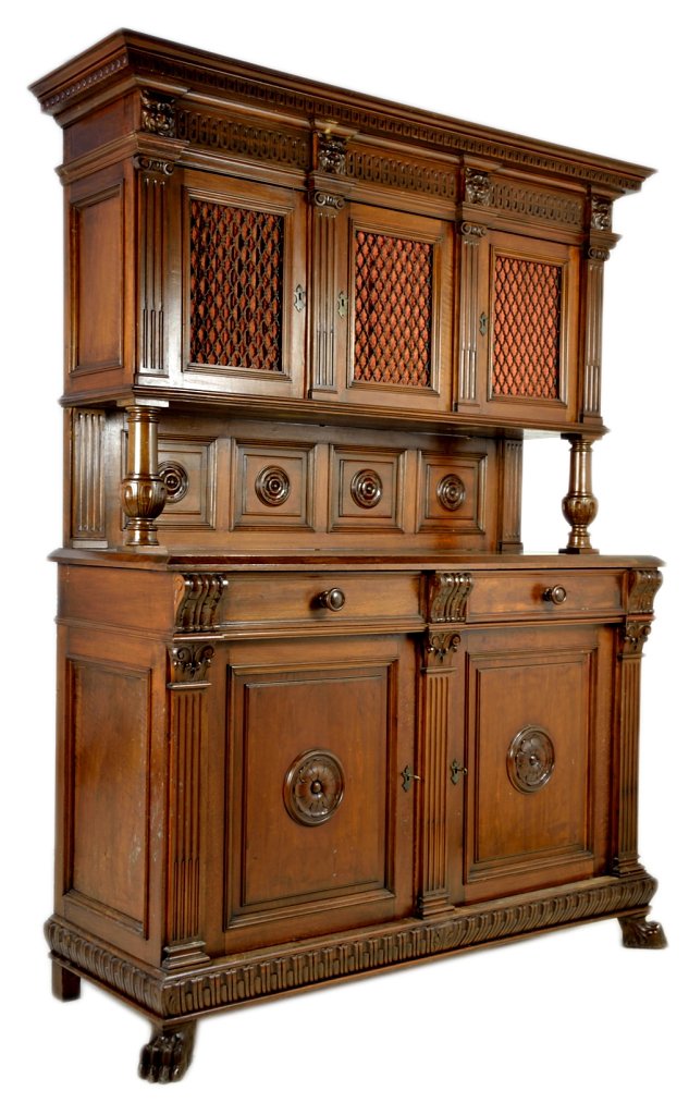 RENAISSANCE REVIVAL STYLE WALNUT CREDENZA: RENAISSANCE REVIVAL STYLE WALNUT CREDENZA Early 20th Century A double door and drawer base with triple door storage raised above on turned posts, metal grille door inserts, raised panel backsplash fea