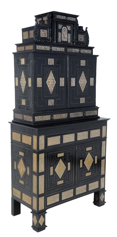 A FINE AND RARE ANTIQUE GERMAN PEWTER INLAID CABINE: A FINE AND RARE ANTIQUE GERMAN PEWTER INLAID CABINET ON STAND Cabinet late 17th Century, Stand 19th Century The ebonized cabinet of ""Curiousities"" features an architectural cornice reaching carved s