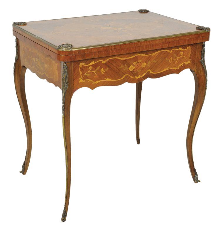 A LOUIS XV STYLE MARQUETRY INLAID ORMOLU MOUNTED R: A LOUIS XV STYLE MARQUETRY INLAID ORMOLU MOUNTED ROSEWOOD GAME TABLE France, Late 19th Century The flip top lifts and rotates to reveal a green felt playing surface with inlaid floral marquetry on all