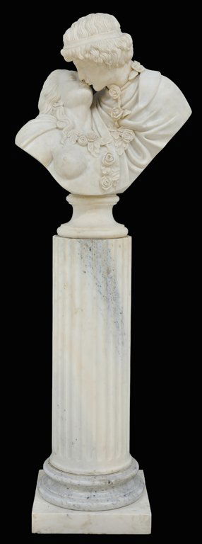 AN ITALIAN CARRARA MARBLE BUST OF LOVERS 20th Cent: AN ITALIAN CARRARA MARBLE BUST OF LOVERS 20th Century The large white marble bust carved in the form of two lovers, dressed in Classical garb, about to kiss, both wearing a cloak and a rose garland ar