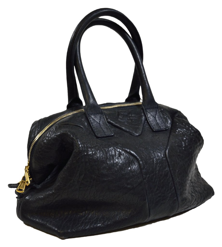 YVES SAINT LAURENT HANDBAG: YVES SAINT LAURENT HANDBAG France, 20th Century. The classic black Easy Bag made of textured leather with a central Y panel on each side, with two drop handles and a zipper along the top for easy acce