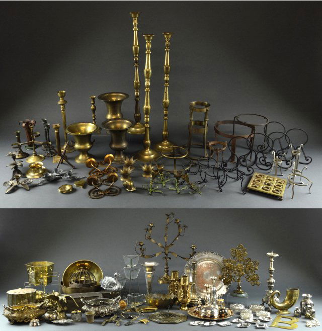 SIX SHELVES OF DECORATIVE METAL ITEMS: SIX SHELVES OF DECORATIVE METAL ITEMS 20th Century A large grouping of stands, candle sticks and holders, bowls, sundial, planters, figures and much more, in a variety of metals, iron, brass, silverpl