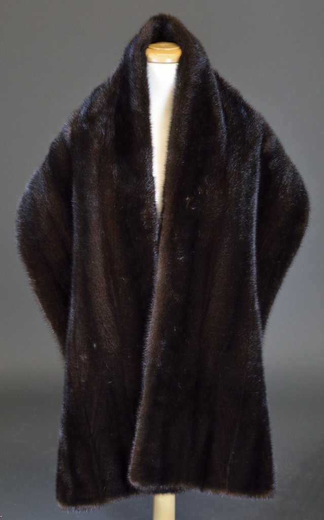 A NATURAL MAHOGANY MINK STOLE: A NATURAL MAHOGANY MINK STOLE 20th Century. A beautiful, full pelt stole, lined in mahogany silk satin with interior stabilizing ""arm bands."" 72 x 14 inches