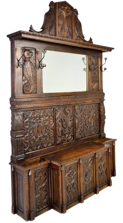 ANTIQUE FRENCH CARVED OAK HALL BENCH: ANTIQUE FRENCH CARVED OAK HALL BENCH France, 19TH Century An interesting combination of the Gothic and Renaissance Revival styles, the base with storage bench, having incise and relief carved Gothic m