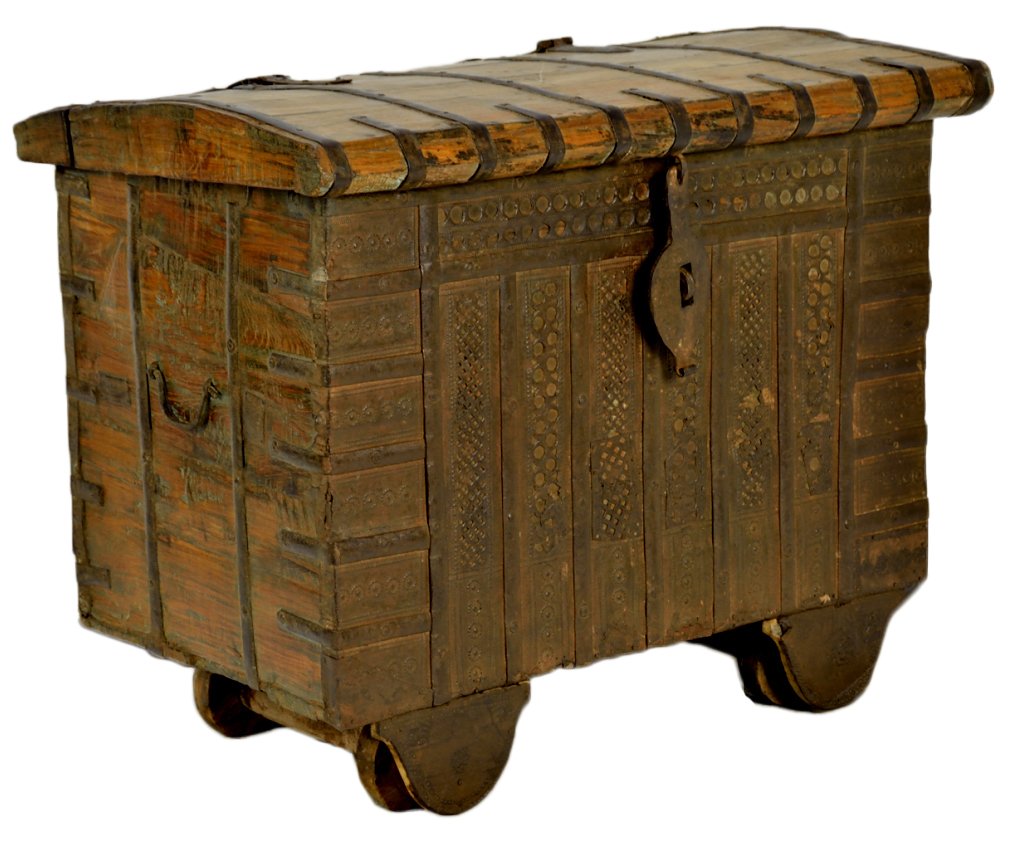 ANTIQUE HANDMADE DOWRY CHEST: ANTIQUE HANDMADE DOWRY CHEST 19th Century, India, Rajasthan Province Solid teak dowry chest with hand forged iron hardware, embossed and pierce carved metalwork and handmade wood wheels. 26 x 31 x 19 