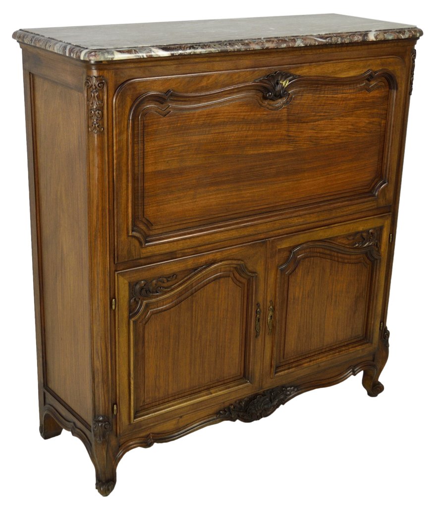 LOUIS XV STYLE BAR CABINET: LOUIS XV STYLE BAR CABINET France, Early 20th Century Walnut; double door cabinet with marble top, having shaped raised panels with carved decoration at the corners, below a drop front serving or bar 
