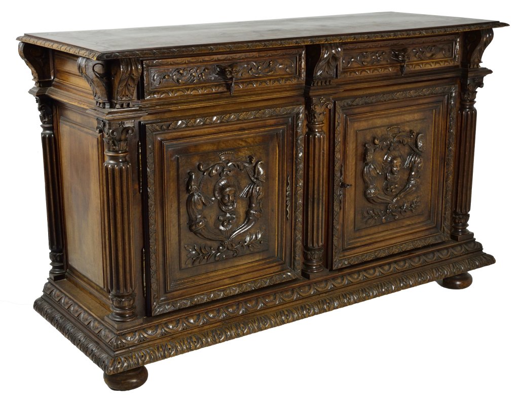 ANTIQUE RENAISSANCE REVIVAL STYLE BUFFET: ANTIQUE RENAISSANCE REVIVAL STYLE BUFFET France, 19th Century Solid walnut; heavily carved door and drawer panels, all with step molded edge having a different motif carved on each layer, a similar de