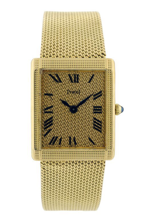 LADIES 18K YELLOW GOLD PIAGET WATCH Very good condi: LADIES 18K YELLOW GOLD PIAGET WATCH A rectangular face with raised gold bezel cut in a grid with a face of tiny chainmail design on the diagonal; with Piaget stamped on the face and Roman numerals. Th