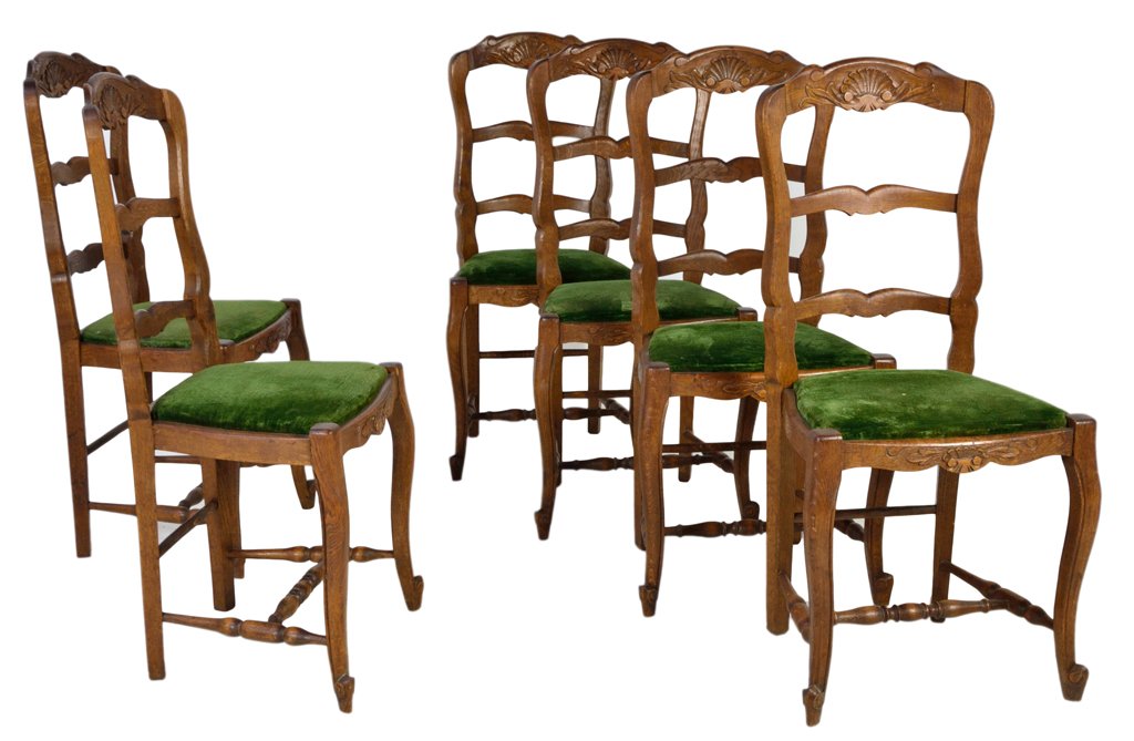 SIX LOUIS XV STYLE LADDER BACK CHAIRS: SIX LOUIS XV STYLE LADDER BACK CHAIRS France, Early 20th Century Solid oak, ladder back style with slightly arched, conforming shape, softly scalloped apron and arched crest rail, with coquillage moti