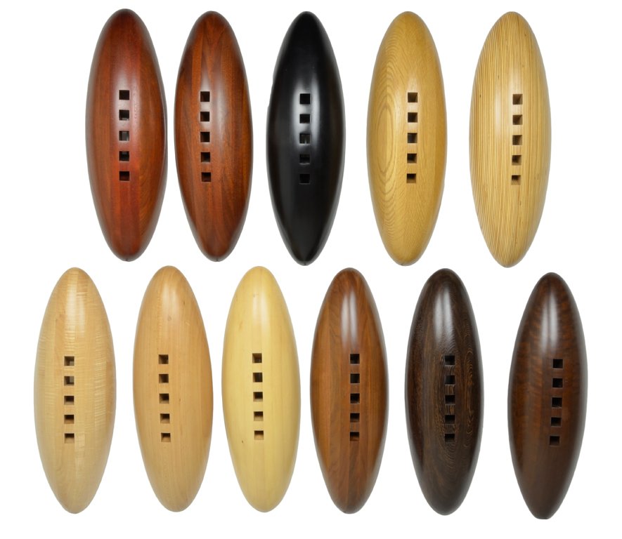 CHRISTOPHER TRIBBLE (American, 1970-). "BREAD LO: CHRISTOPHER TRIBBLE (American, 1970-)."BREAD LOAVES", 2001. 11 elliptical shaped convex abstract wooden forms in the shape of boat hulls pierced by five square section voids which converge as they go