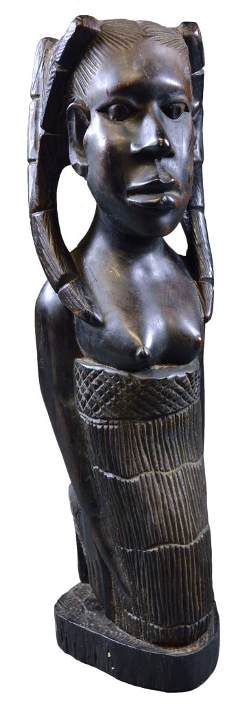 AN AFRICAN CARVED AND EBONIZED KNEELING FIGURE: AN AFRICAN CARVED AND EBONIZED KNEELING FIGURE 20th Century. The heavy dense wood figure depicting a kneeling woman with hair plaited into two locks and wearing a wrapper below her breasts, her child 