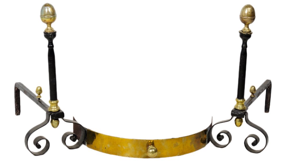 ANTIQUE FRENCH ANDIRONS: ANTIQUE FRENCH ANDIRONS Early 20th Century A heavy pair of cast iron fireplace andirons, painted black with brass acorn finials and highlights with double scrolling feet. 21½ x 8¾ x 20½ inches