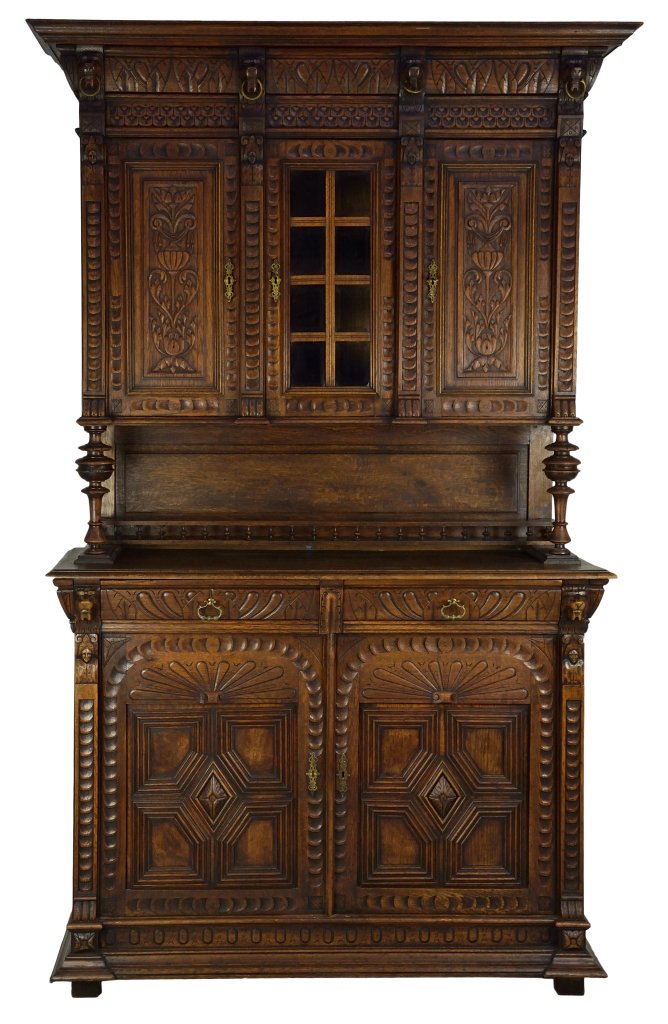 ANTIQUE CARVED OAK SIDEBOARD: ANTIQUE CARVED OAK SIDEBOARD 19th Century An antique oak carved sideboard with flat top cornice, relief carved blocks in the shape of lions head in frieze, ornate chip carving with lions paw details w