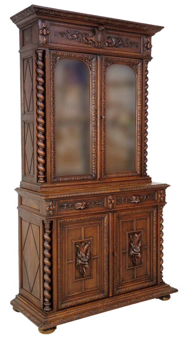 ANTIQUE FRENCH VICTORIAN BIBLIOTHEQUE: ANTIQUE FRENCH VICTORIAN BIBLIOTHEQUE 19th Century, France Function and display, this French Victorian style oak buffet bookcase has a step molded crown with a protruding cabochon medallion surrounded