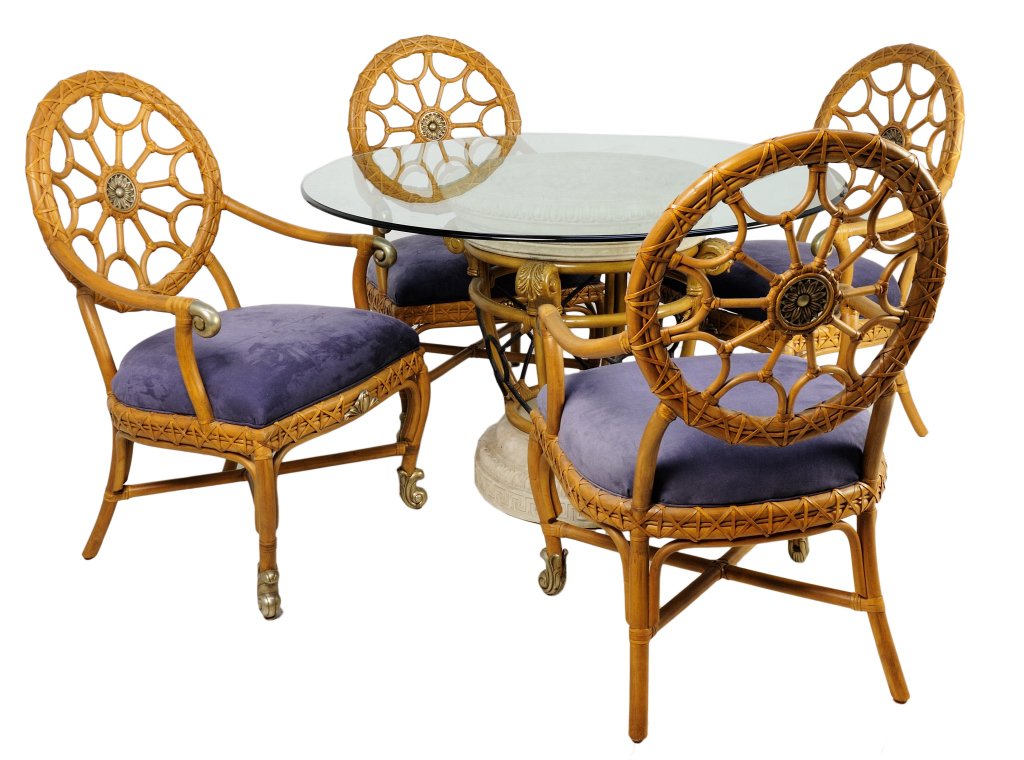 BAMBOO DINING SET AND FOUR ARMCHAIRS: BAMBOO DINING SET AND FOUR ARMCHAIRS 20th Century A bamboo dining set with to large acanthus designed plinth base and top, a glass table top, and four web designed bamboo arm chairs with bronze detail