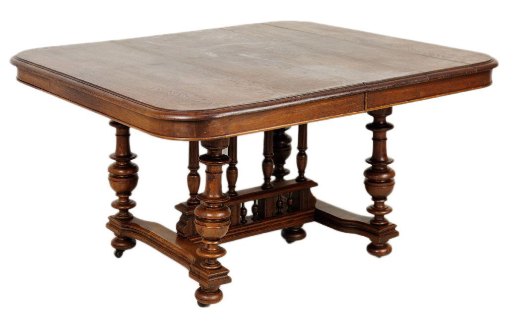ANTIQUE FRENCH VICTORIAN STYLE DINING TABLE: ANTIQUE FRENCH VICTORIAN STYLE DINING TABLE Late 19th - Early 20th Century, France This oak table has rounded edges and step carved edge and a smooth apron, raised on large vase turned uprights with a