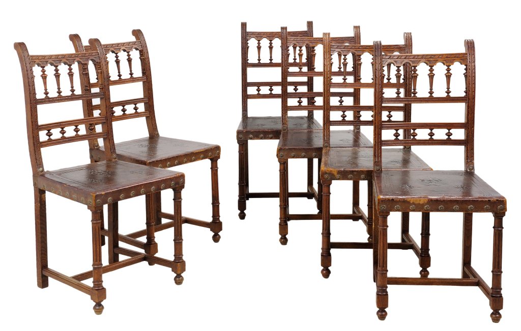 ANTIQUE FRENCH VICTORIAN STYLE SIDE CHAIRS: ANTIQUE FRENCH VICTORIAN STYLE SIDE CHAIRS Late 19th - Early 20th Century A set of six oak carved French Victorian style side chairs with a ribbon and reed arch finial pierce cut ladder back, acanthus