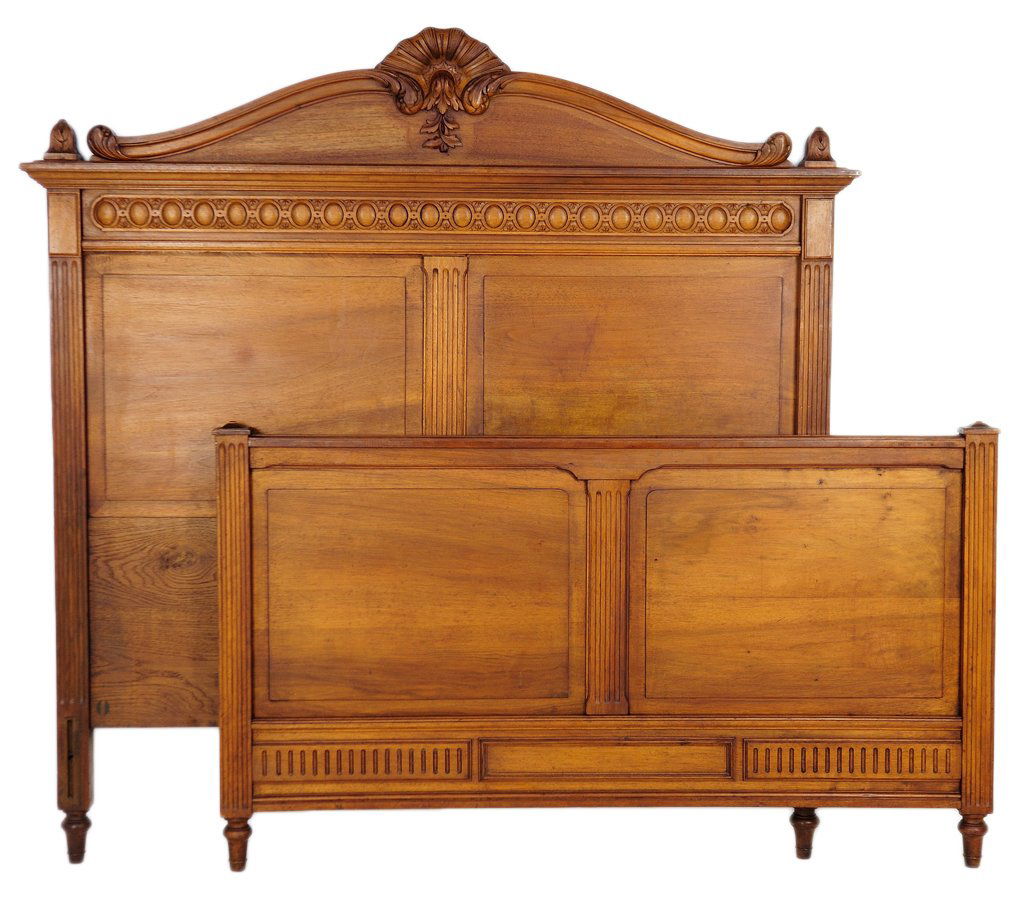 FRENCH VICTORIAN STYLE WALNUT BED: FRENCH VICTORIAN STYLE WALNUT BED Late 19th Century, France The headboard crowned by a scrolling foliate arch pediment with a cabochon carved frieze, featuring reeding at edges and raised panel constr