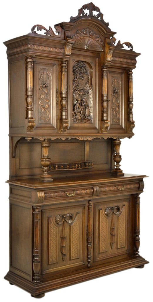 A HENRI II FRENCH VICTORIAN WALNUT BUFFET: A HENRI II FRENCH VICTORIAN WALNUT BUFFET Early 20th Century, France This carved walnut buffet is crowned by a pierced carved acanthus and dragon spandrel with an arch top cornice, having carved acant