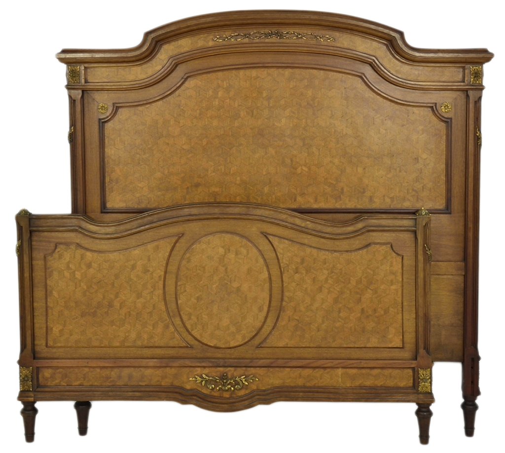 A LOUIS XVI STYLE GEOMETRIC PARQUETRY BED: A LOUIS XVI STYLE GEOMETRIC PARQUETRY BED Early 20th Century, France In the style of Louis XVI, this bed having a slightly arched top with inverted stepped edge, featuring an inlaid geometric parquetr