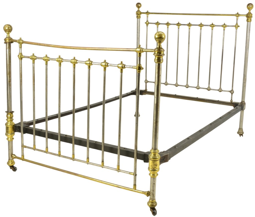 ANTIQUE BRASS BED: ANTIQUE BRASS BED 1st Quarter 20th Century A turn of the century dual toned steel and cast brass bed features ball finials flanking at top with nine uprights, raised on castors with a built in hanging