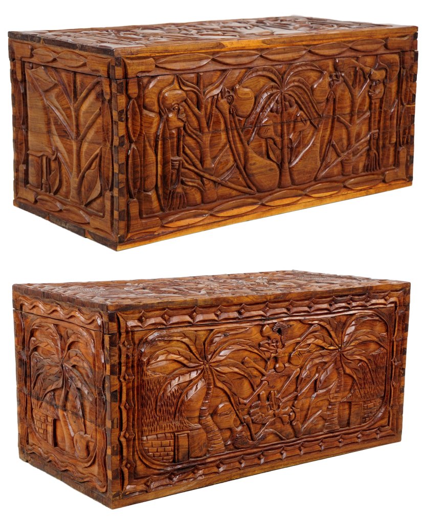 A PAIR OF CARVED AFRICAN STYLE SANDALWOOD TRUNKS V: A PAIR OF CARVED AFRICAN STYLE SANDALWOOD TRUNKS 20th Century Hand carved and polished solid sandalwood hinged trunks from Mozambique featuring intricately detailed carvings of native scenes. 18¾ x 3