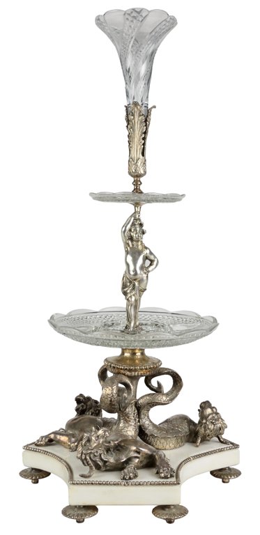 A LOUIS XVI STYLE SILVERED BRONZE CRYSTAL THREE TIER: A LOUIS XVI STYLE SILVERED BRONZE CRYSTAL THREE TIER EPERGNE Early 20th Century The trumpet-form cut crystal vase is supported by silvered bronze acanthus leaves and scalloped edge cut crystal bowl ab