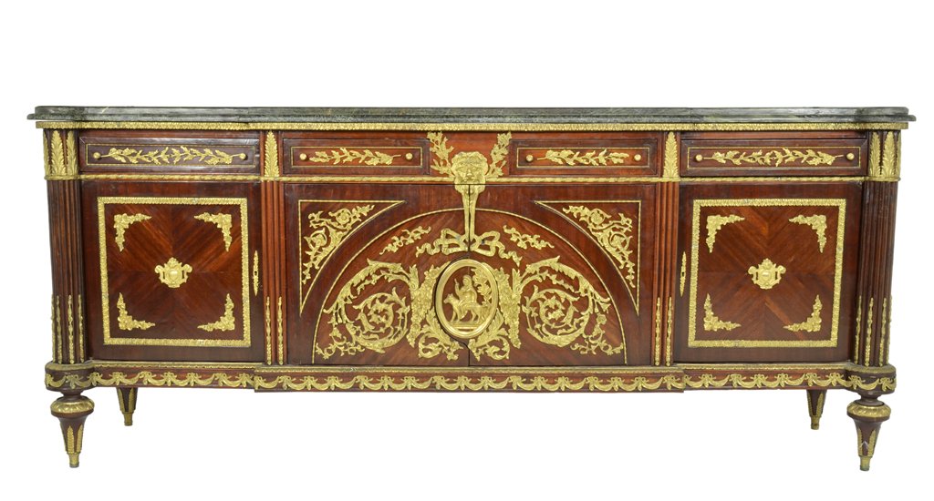 A FINE LOUIS XVI STYLE MAHOGANY SIDEBOARD WITH GILT: A FINE LOUIS XVI STYLE MAHOGANY SIDEBOARD WITH GILT BRONZE MOUNTS Late 19th Century A shaped verte marble stepped top is supported by a conforming mahogany walnut body housing four drawers and two loc