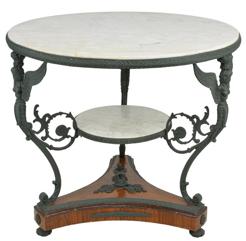 AN EMPIRE STYLE MAHOGANY AND BRONZE TABLE WITH WHI: AN EMPIRE STYLE MAHOGANY AND BRONZE TABLE WITH WHITE MARBLE TOP 19th Century White marble top two tier table featuring a patinated bronze border and scrolling winged caryatid tripod supports joined by