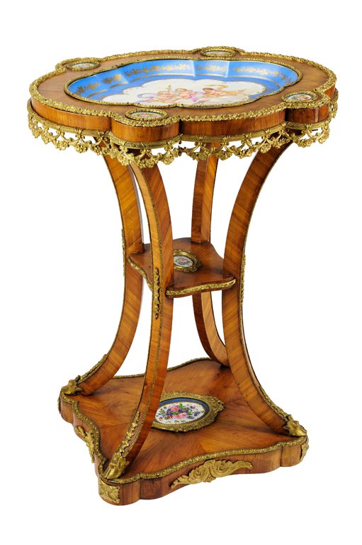 A NAPOLEON III STYLE WALNUT PORCELAIN TRAY TOP TAB: A NAPOLEON III STYLE WALNUT PORCELAIN TRAY TOP TABLE19th Century The shaped walnut tray top features an inset hand painted centered porcelain portrait of three reclining cherubs in the clouds with an 
