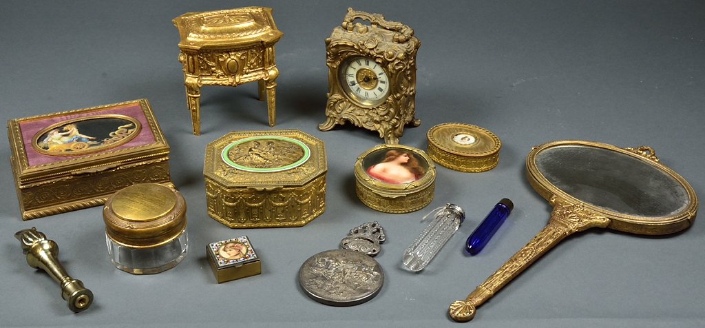 A LADIES VANITY COLLECTION: A LADIES VANITY COLLECTION 20th Century A grouping of twelve lady's design elements includes a torchier finial, an assortment of jewelry and trinket boxes, a clock and two handheld vanity mirrors. 4 x