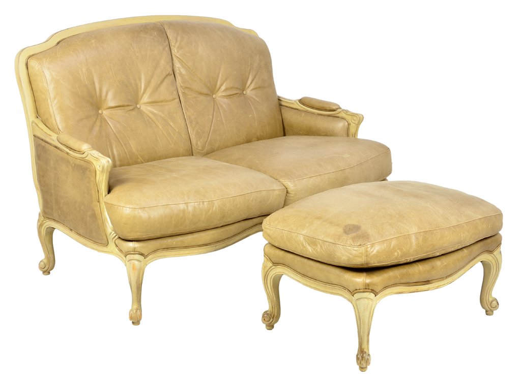 A LOUIS XV STYLE SETTEE WITH OTTOMAN Overall good condi: A LOUIS XV STYLE SETTEE WITH OTTOMAN 20th Century A Louis XVI style settee and companion ottoman is painted crème and covered with taupe leather, having cushioned arm rests, lightly tufted back, rais