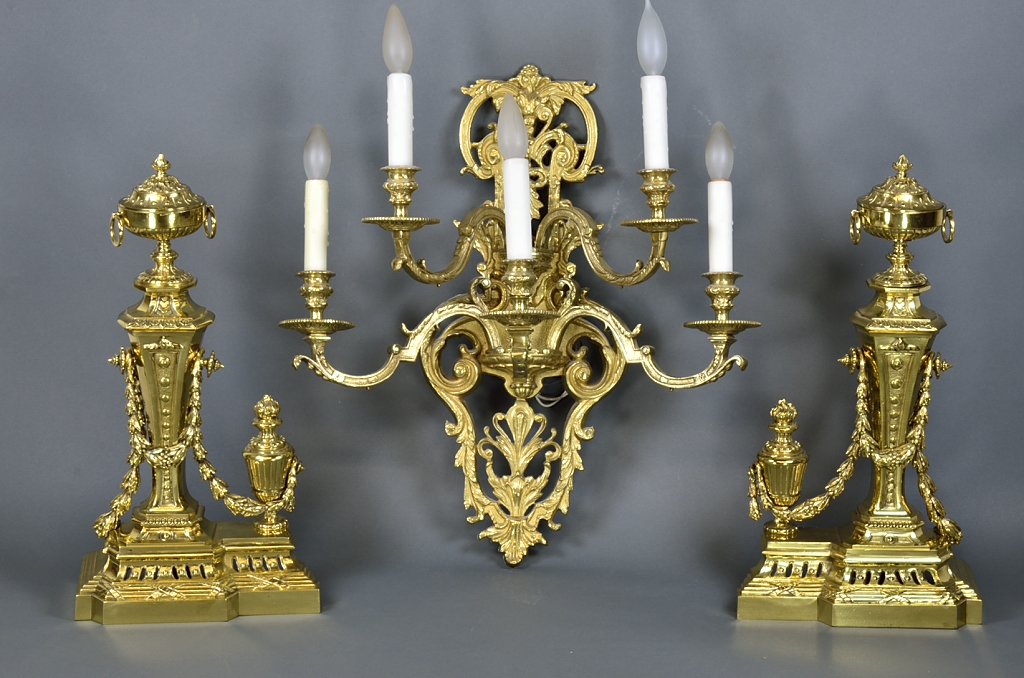 A FRENCH VICTORIAN GILT BRONZE FIVE-LIGHT SCONCE AND PA: A FRENCH VICTORIAN GILT BRONZE FIVE-LIGHT SCONCE AND PAIR OF ANDIRONS Early 20th Century A five-light sconce featuring gilt cast bronze scrollwork and acanthus accents; wired for electricity. Each and