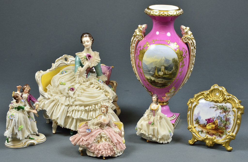 A PINK URN AND DANCING DRESDEN STYLE FIGURINE GROUP: A PINK URN AND DANCING DRESDEN STYLE FIGURINE GROUP Early 20th Century A DRESDEN style grouping features two ladies on settees, a dancing couple, a single standing lady, a hand painted sculpted frame