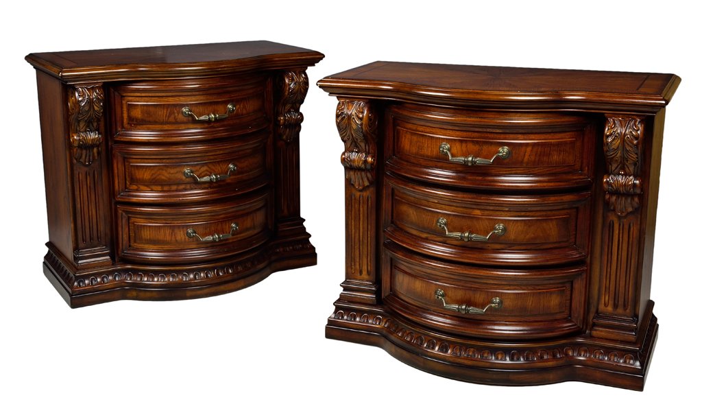 A PAIR OF FAIRMONT DESIGNS THREE DRAWER COMMODES: A PAIR OF FAIRMONT DESIGNS THREE DRAWER COMMODES 20th Century The shaped walnut finish plank tops are supported by recessed conforming bodies each housing three drawers flanked by corbels and pilaster
