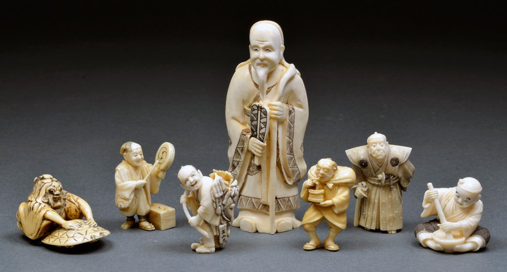 A COLLECTION OF SEVEN JAPANESE IVORY NETSUKE CARVINGS: A COLLECTION OF SEVEN JAPANESE IVORY NETSUKE CARVINGS Late 19th - Early 20th Century, Japan A collection of seven hand carved ivory Netsuke figures are signed or stamped. Some having damage; pieces in