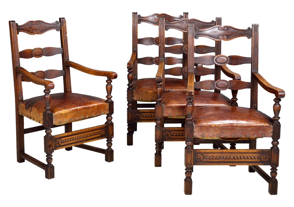 A QUARTET OF FOUR FRENCH RUSTIC LOUIS XIII STYLE ARMCHA: A QUARTET OF FOUR FRENCH RUSTIC LOUIS XIII STYLE ARMCHAIRS Late 19th Century, France A set of four Louis XIII style ladder back chairs having carved scroll details on a shaped crest rail, with carved 