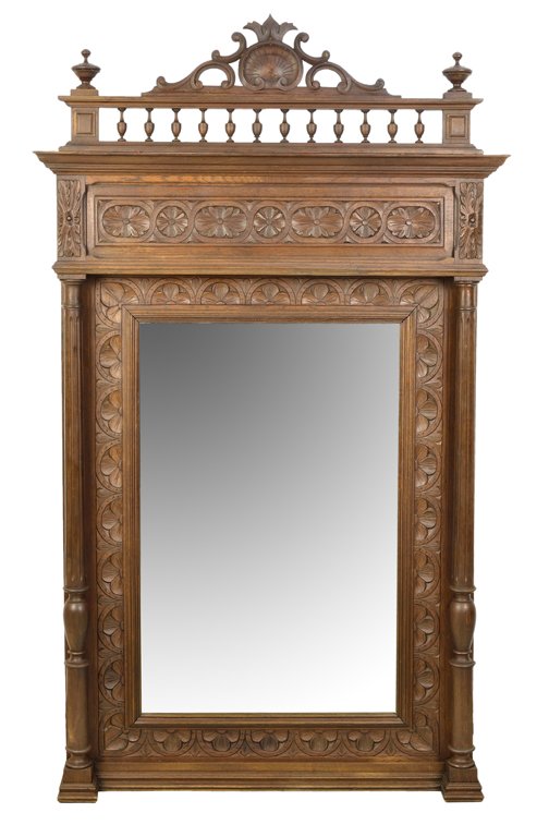 AN ANTIQUE HENRY II FRENCH VICTORIAN STYLE MIRROR: AN ANTIQUE HENRY II FRENCH VICTORIAN STYLE MIRROR Early 20th Century, France A large French Victorian style mirror having a pierce carved shell and acanthus cornice is flanked by two finials, having a