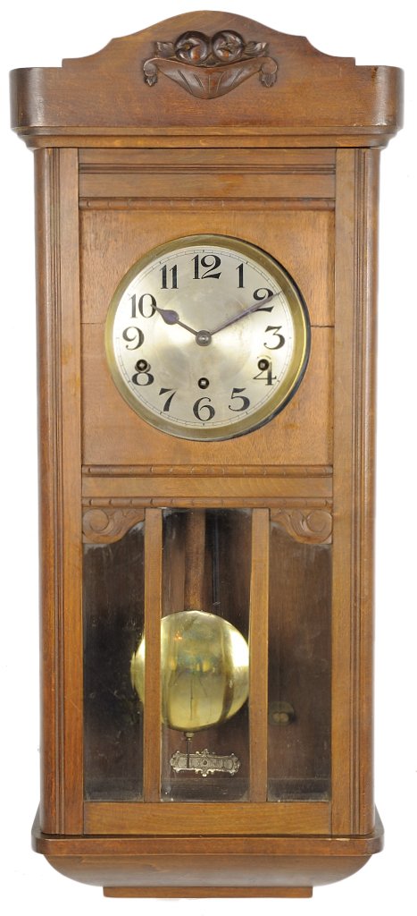 A VICTORIAN STYLE WALNUT WALL CLOCK: A VICTORIAN STYLE WALNUT WALL CLOCK Early 20th Century Includes a six rod chime and pendulum, lacks key. 32 x 13½ x 7½ inches