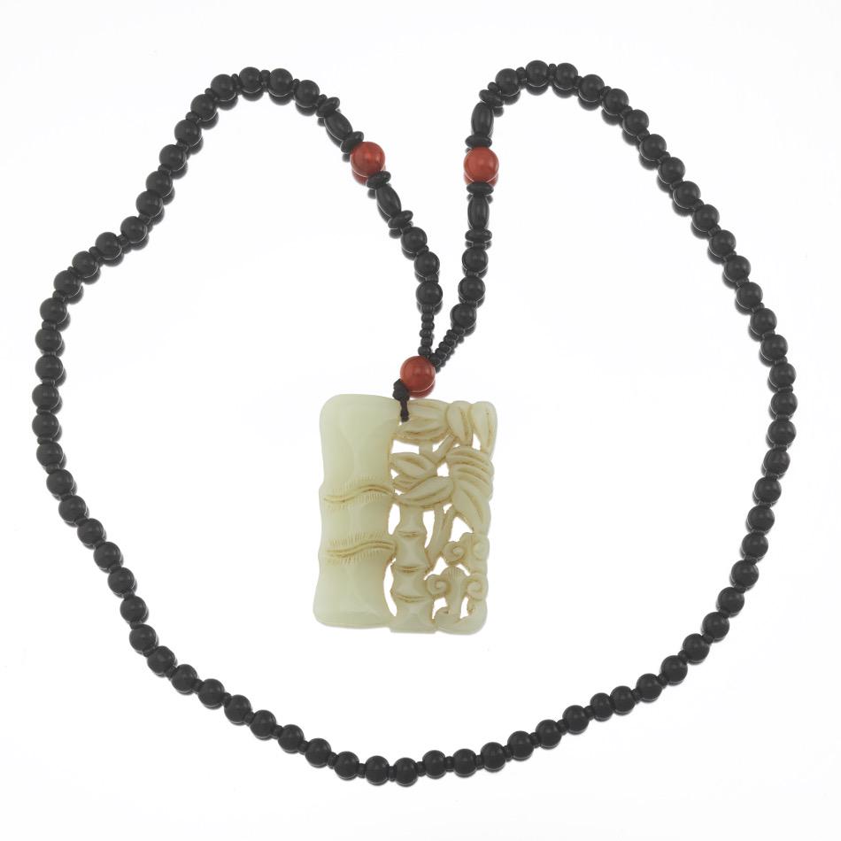 Chinese Black Onyx, Carnelian and Antique Carved Mutton: 25-1/2", 3-3/4" Well carved and polished mutton fat jade openwork double sided pendant, depicting bamboo sprays and lingzhi fungi, silk braided cord with black onyx 6 mm beads and seed beads, with car