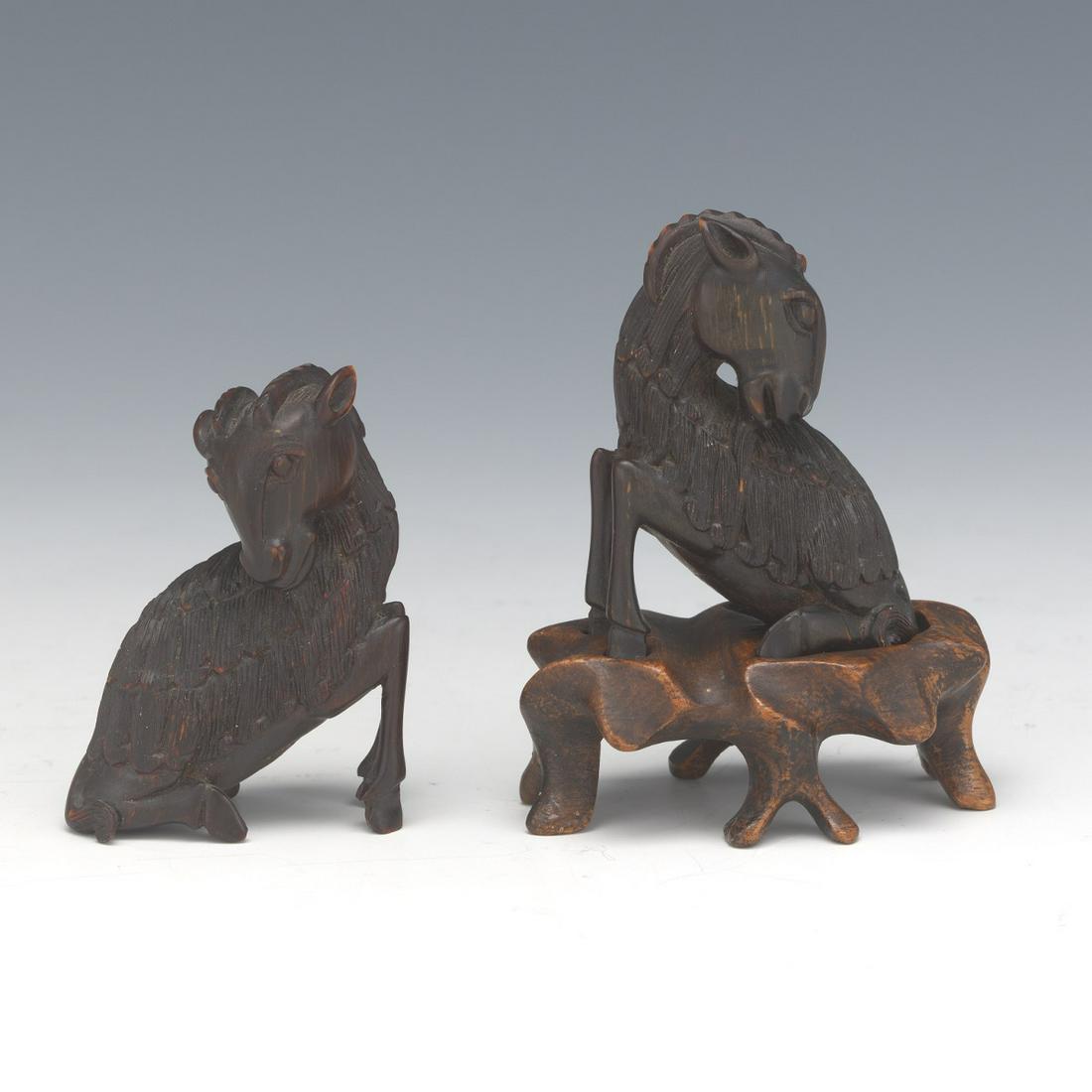 Two Chinese Carved Horn Rams on Fitted Carved Wood: Two Chinese Carved Horn Rams on Fitted Carved Wood Stand, ca. Qing Dynasty 2-1/4" x 1-5/8" x 7/8" and 2-1/8" x 1-5/8" x 1" Two finely minute carved horn depicting 3D declining rams, one - on carved wo