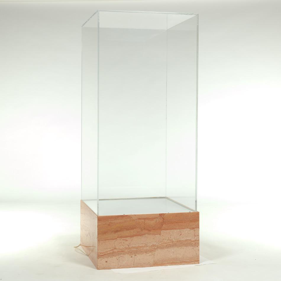 Display Case with Light on Marbled Base: Heavy base with marble overlay, under lighting with frosted top; plexiglass vitrine above; wired. Vitrine measures 45-1/2" x 23-1/4" x 23-1/2". Base measures 12-1/4" x 24" x 24". Provenance: private p