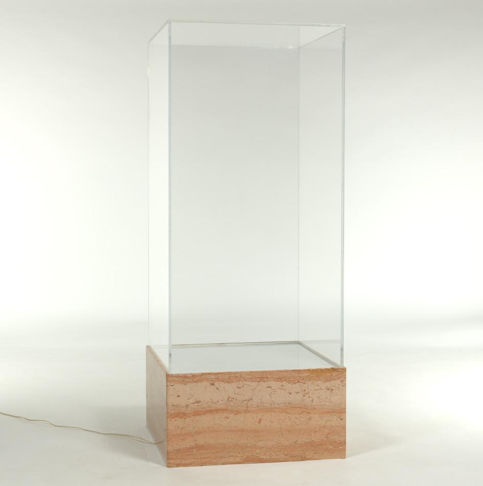 Display Case with Light on Marbled Base: Heavy base with marble overlay, under lighting with frosted top; plexiglass vitrine above; wired. Vitrine measures 45-1/2" x 23-1/4" x 23-1/2". Base measures 12-1/4" x 24" x 24". Provenance: private p