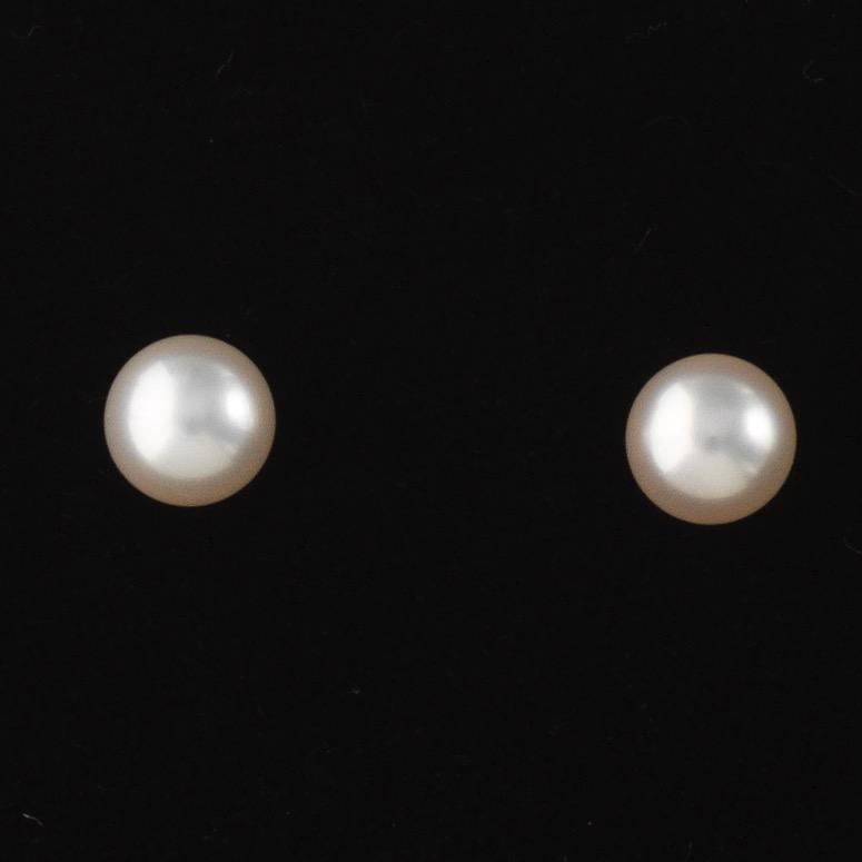 Mikimoto Sea Magic "Blue Lagoon" Pair of Gold and Pearl: 7-7.5mm pearls 14k yellow gold pair of studs with pierced push back, set with high lustre 7-7.5mm pearls; fully marked with Mikimoto Sea Magic "BL" hallmark on the back; overall weight 1.8 gm. Offered