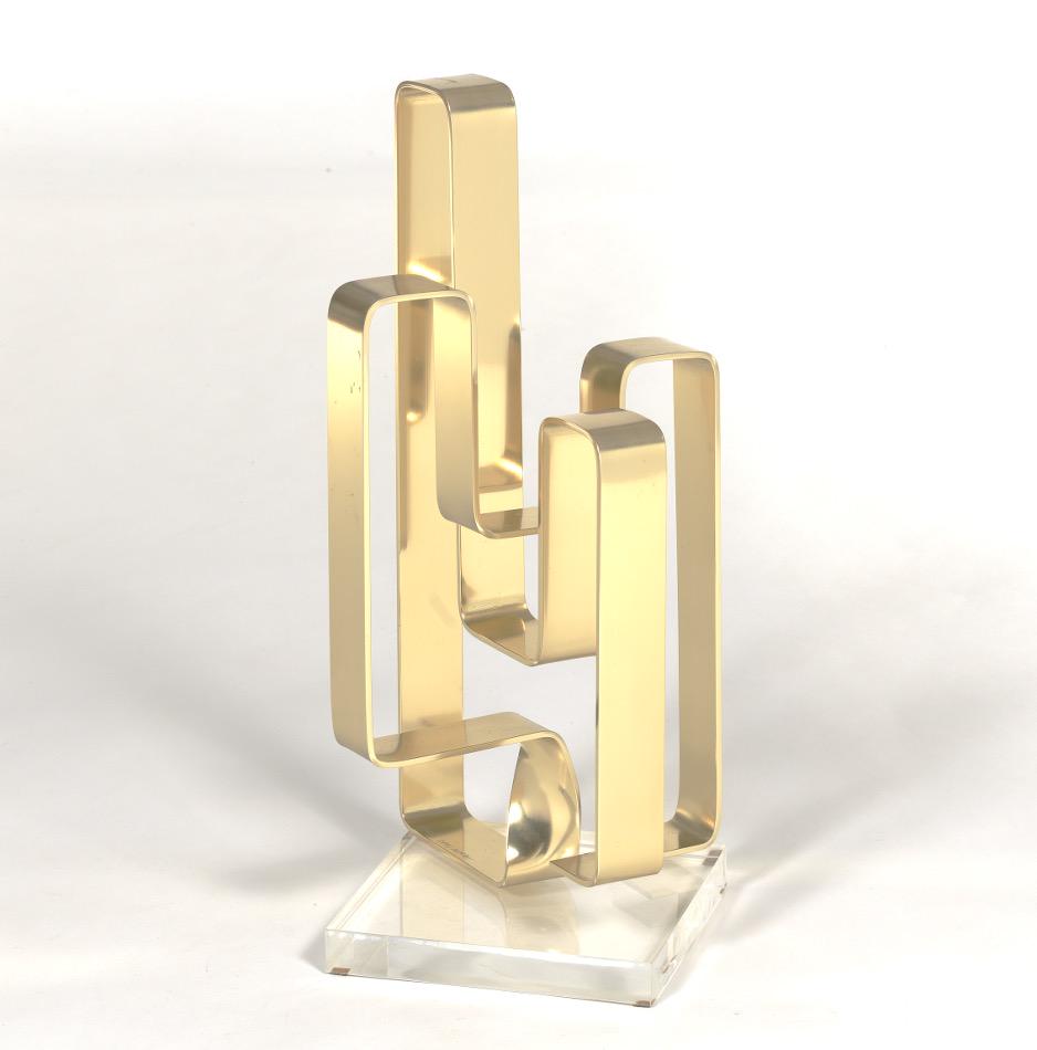 Dan Murphy (American, Contemporary): 17-1/8" x 7" x 7" "The Foutainhead." Modern gold tone anodized metal sculpture on a clear acrylic base, cork feet. Signed and dated 1978. Provenance: private collection, Pittsburgh, PA.