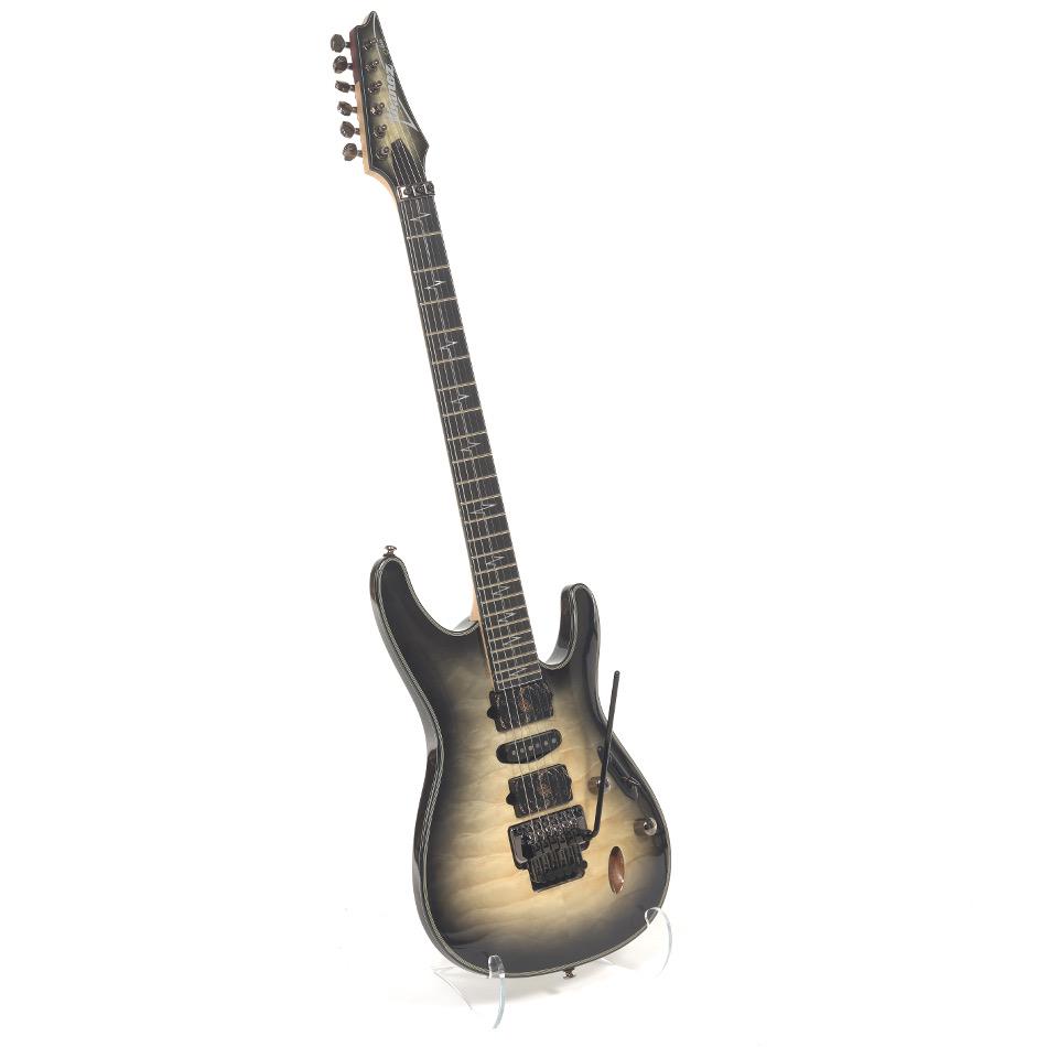 Ibanez Nita Strauss Signature JIVA10 Electric Guitar: Nyathoh and maple solid body, Edge Zero II bridge with a ball bearing tremolo bar system, Wizard three piece purpleheart maple neck. Crafted in Indonesia in 2014. # I 190422701.No case or accessories.