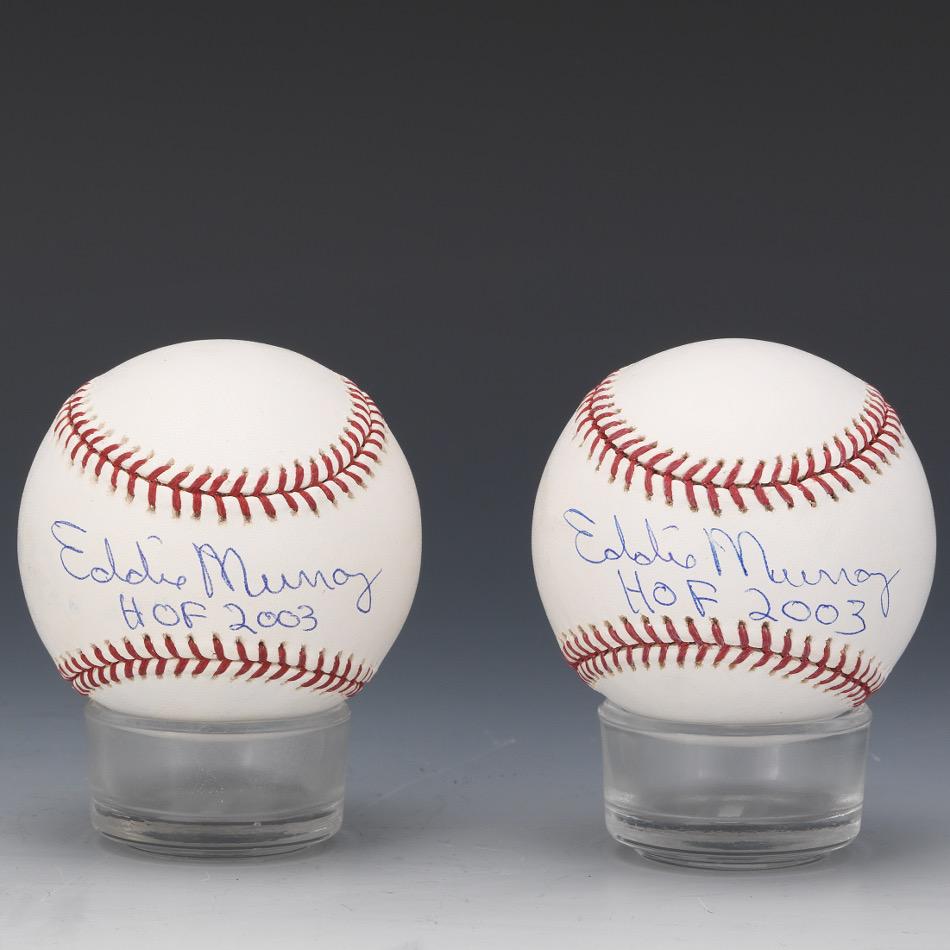 Pair of Eddie Murray Autographed Baseballs: Eddie Murray "HOF 2003" blue pen signature on t an OML baseball with Letter of Authenticity from Global Authentication, and an Eddie Murray HOF 2003 blue pen signature on an OML Selig Ball with Letter